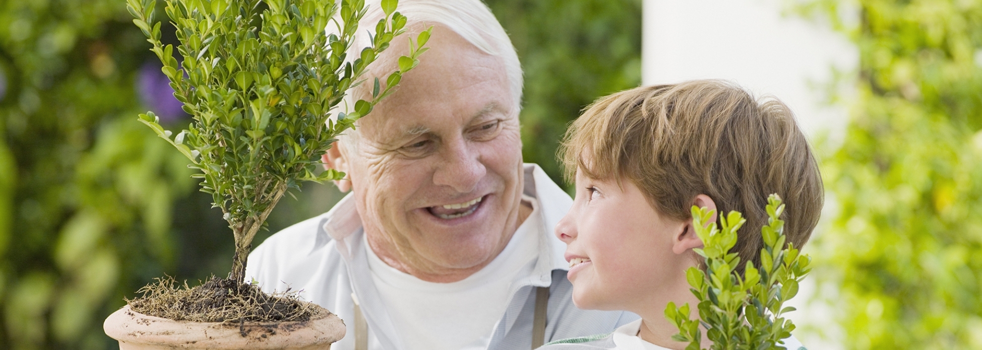 Grandpa and Grandson Potting Plants